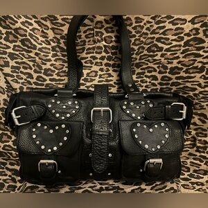 Black leather “duffel style” handbag w studded hearts and clover detail